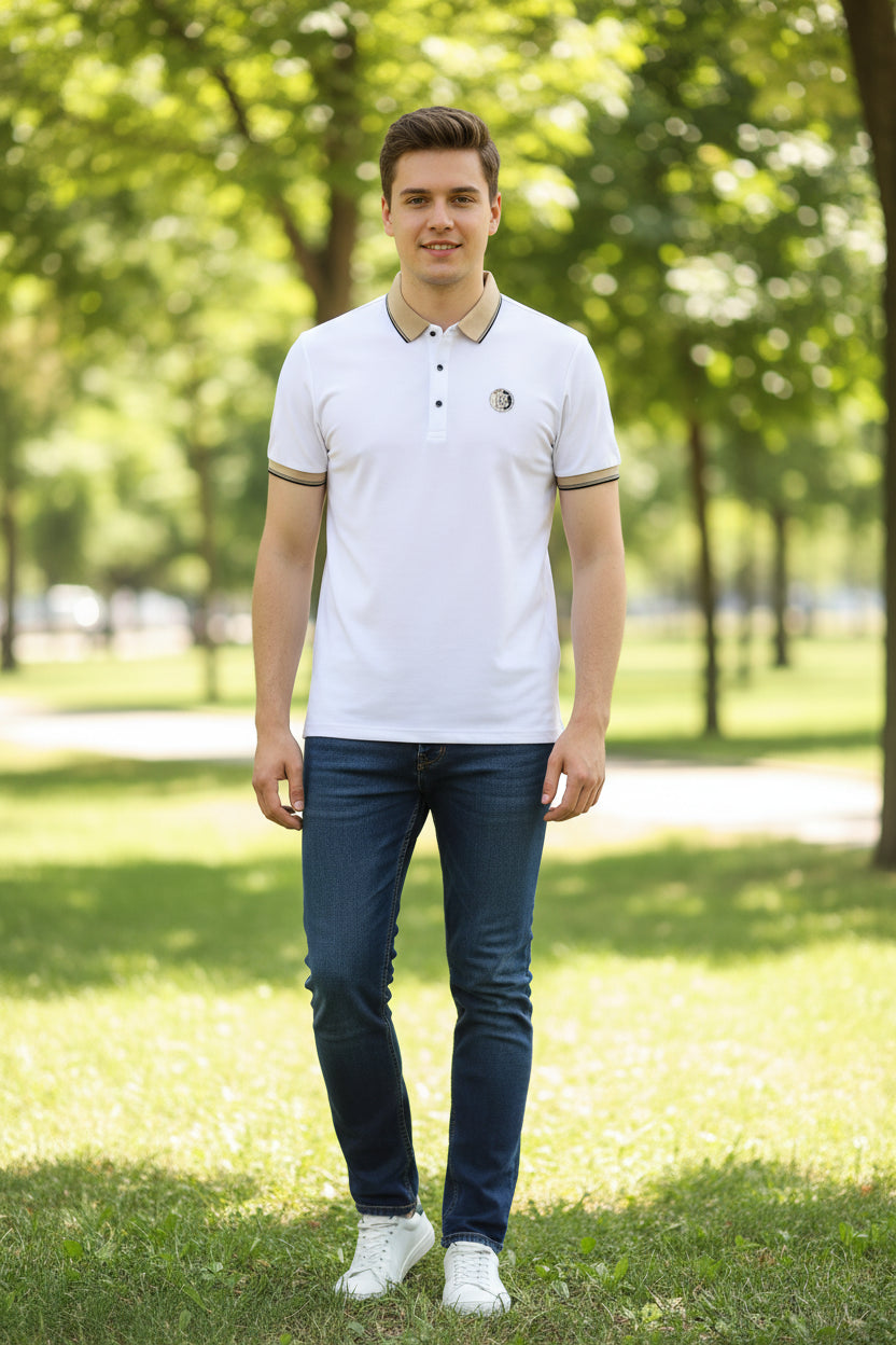 White polo shirt with black accents worn by a person on a dark background