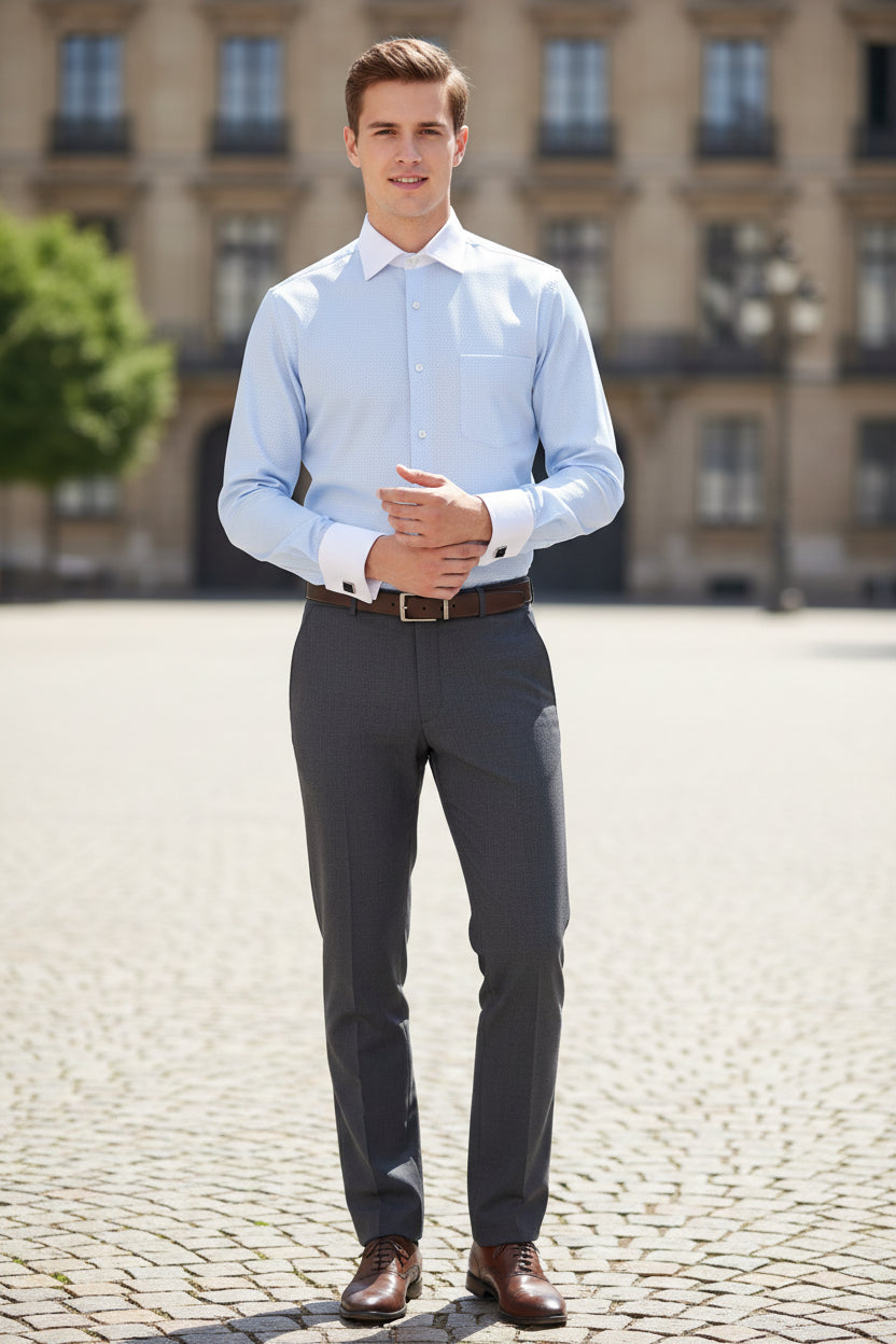 Light blue dress shirt with white collar and cuffs on a white background