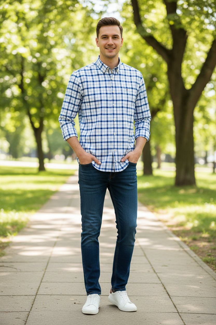 Folded blue and white checkered shirt with brand logo on a light gray background