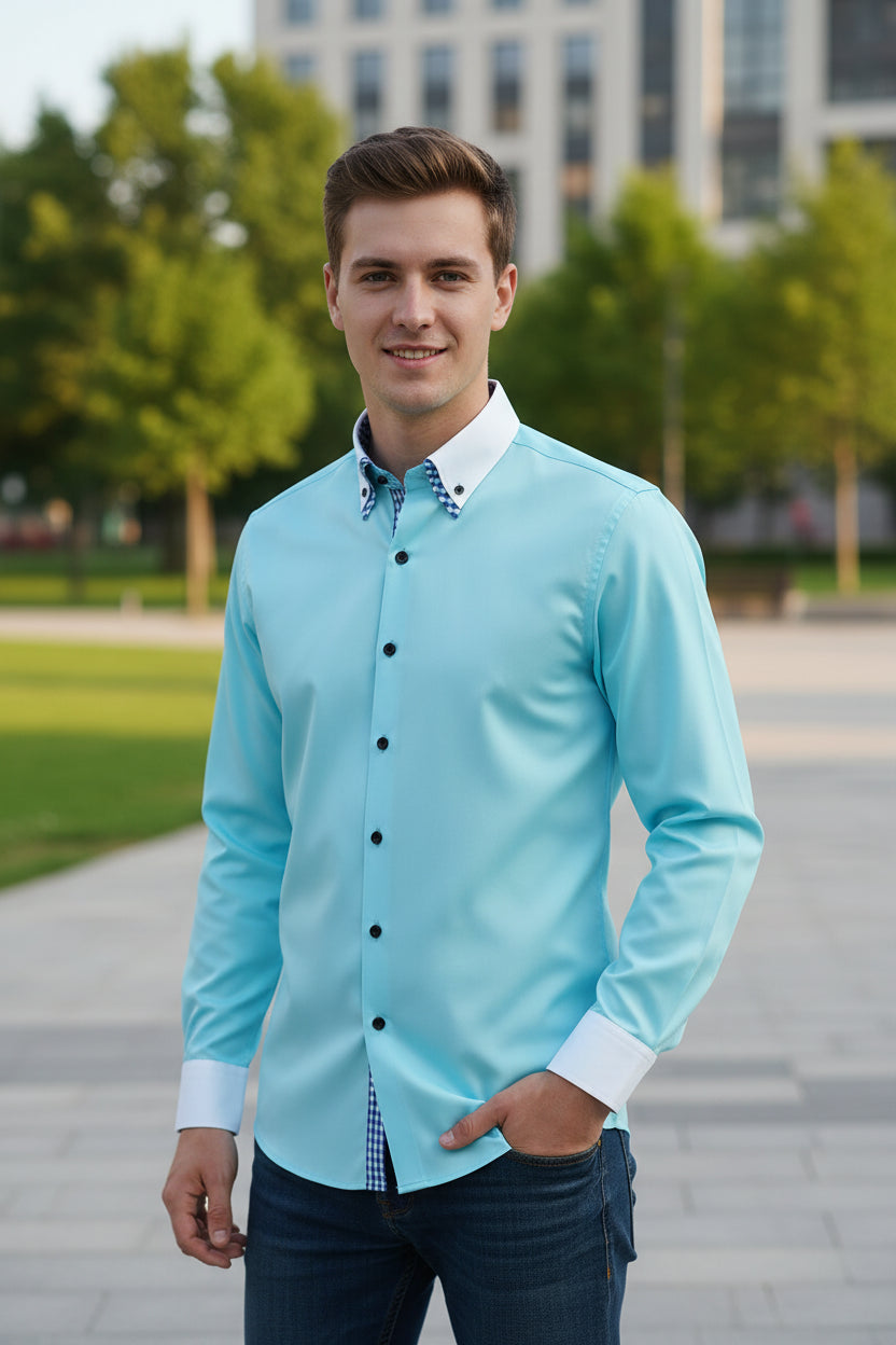 Light blue dress shirt with white collar and cuffs on a gray background