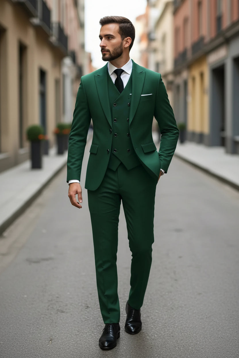 Man wearing a green suit with a white shirt and black tie on a city street.