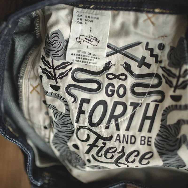 Textile with 'Go Forth and Be Fierce' print and zebra pattern on a textured background