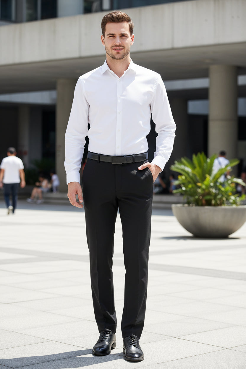 Black dress pants worn by a person on a white background