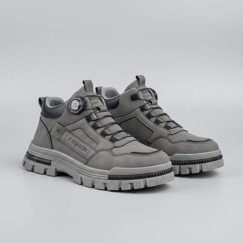 Gray sneakers with brand logo on a light background