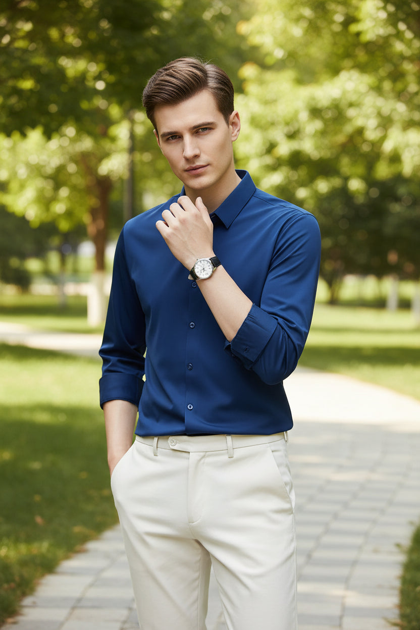 Blue shirt worn by a person on a black background