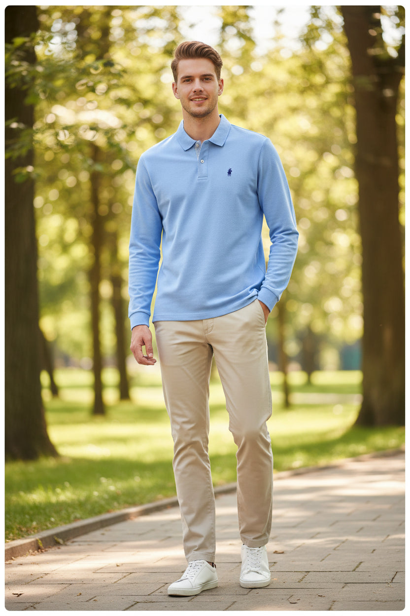 Light blue long-sleeve polo shirt with a small logo on a rack with other shirts.