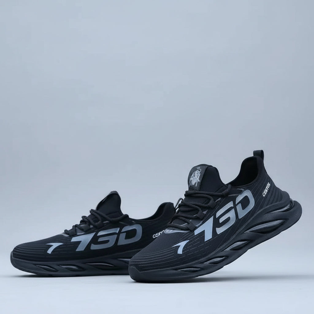 Black athletic shoes with '730' branding worn by a person indoors.