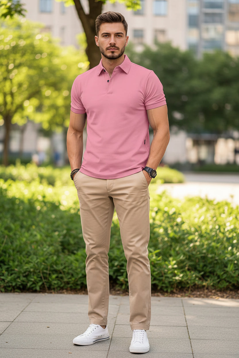 Man wearing a pink polo shirt on a white background