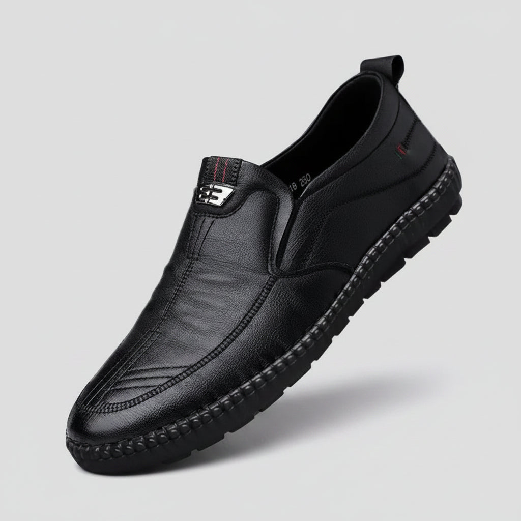 Black leather shoe on a natural background with text