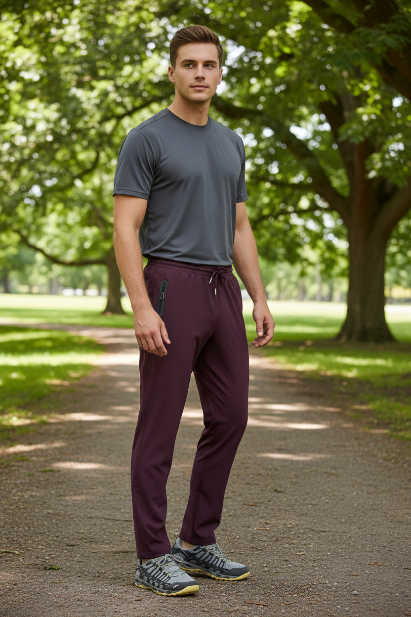 Maroon pants with a zipper pocket on a white background