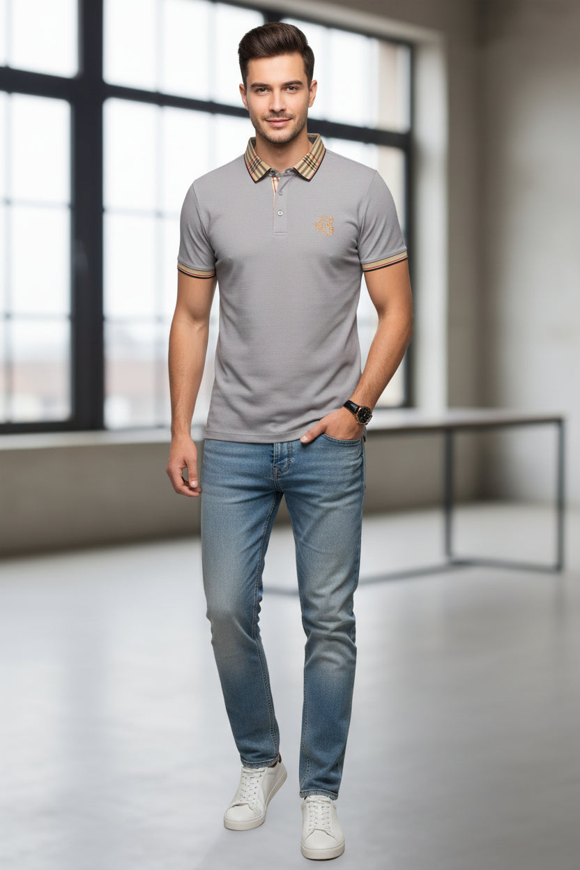 Gray polo shirt with plaid collar, watch, and belt on a gray surface