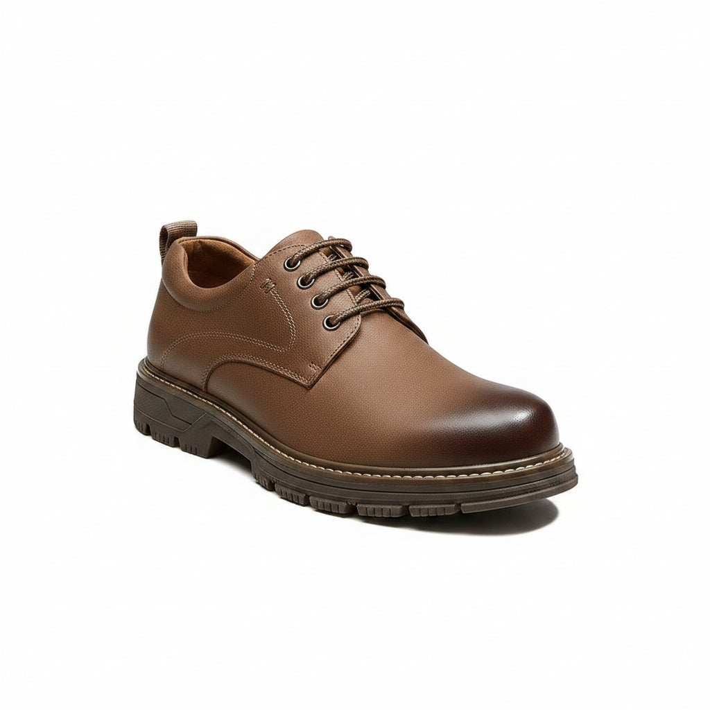 Brown leather shoe with 'Golden Camel' logo on a white background