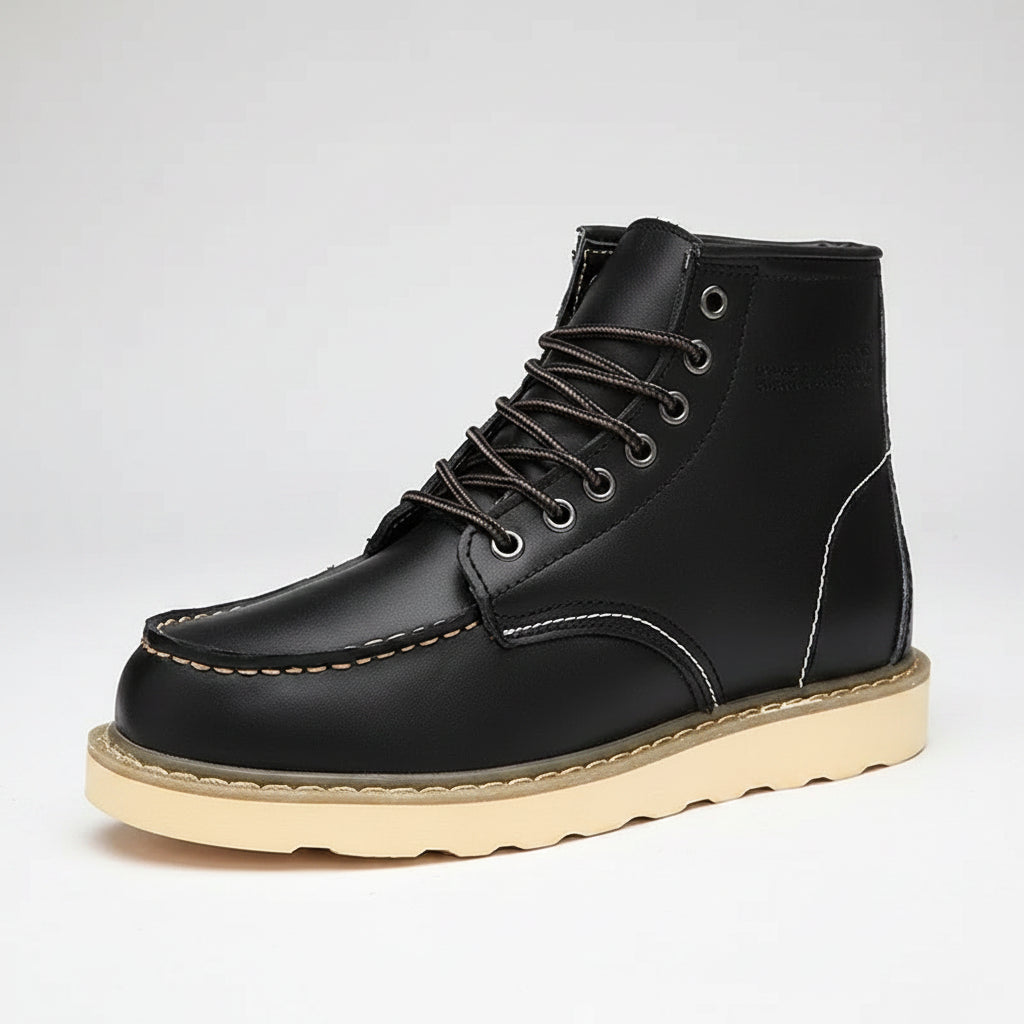 Black leather boot with beige sole on a white background