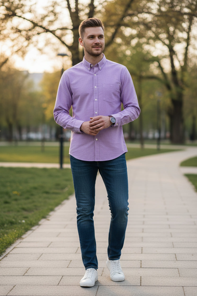 Folded purple shirt on a white background