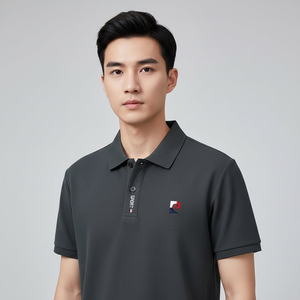 Gray polo shirt with brand logo on a hanger