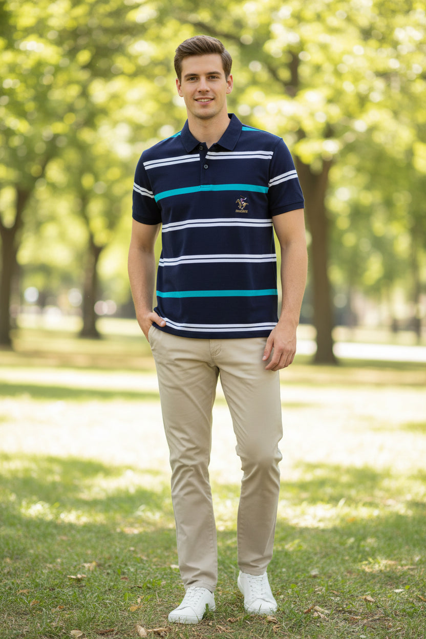Folded navy blue polo shirt with white and turquoise stripes on a gray background