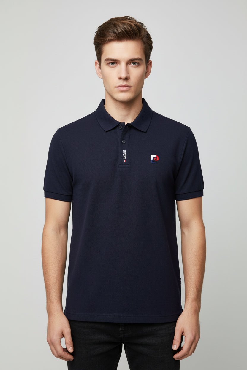 Navy blue polo shirt with brand logo on a hanger