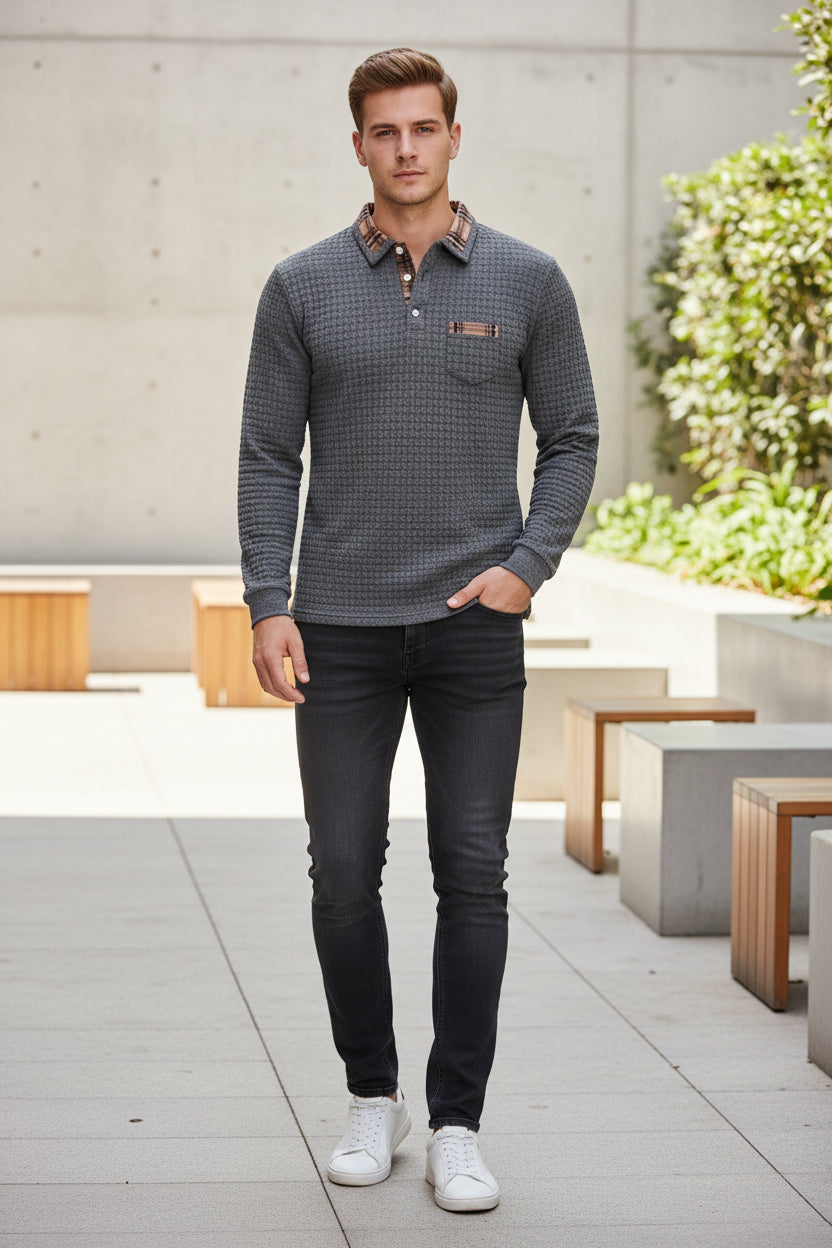 Gray textured sweater with plaid collar and pocket on a white background