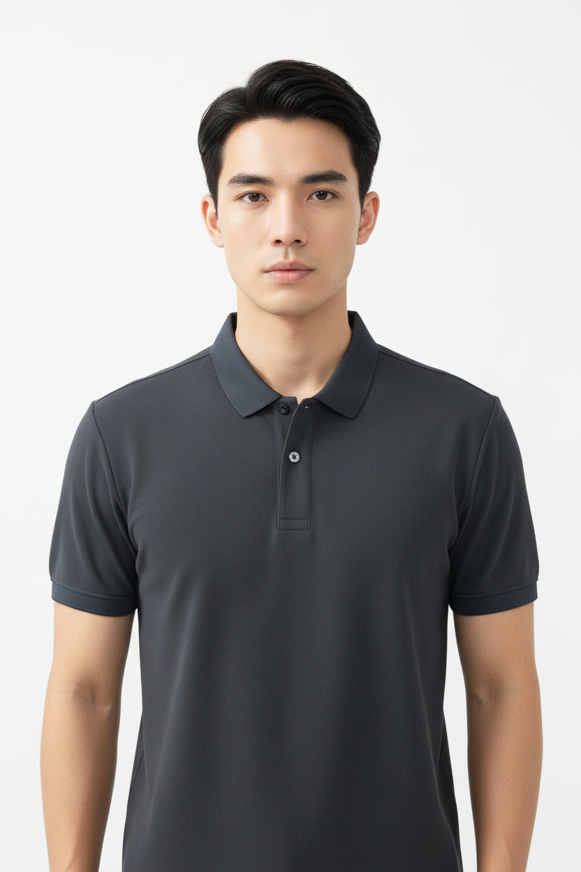 Close-up of a dark gray polo shirt collar with a brand label on a white background
