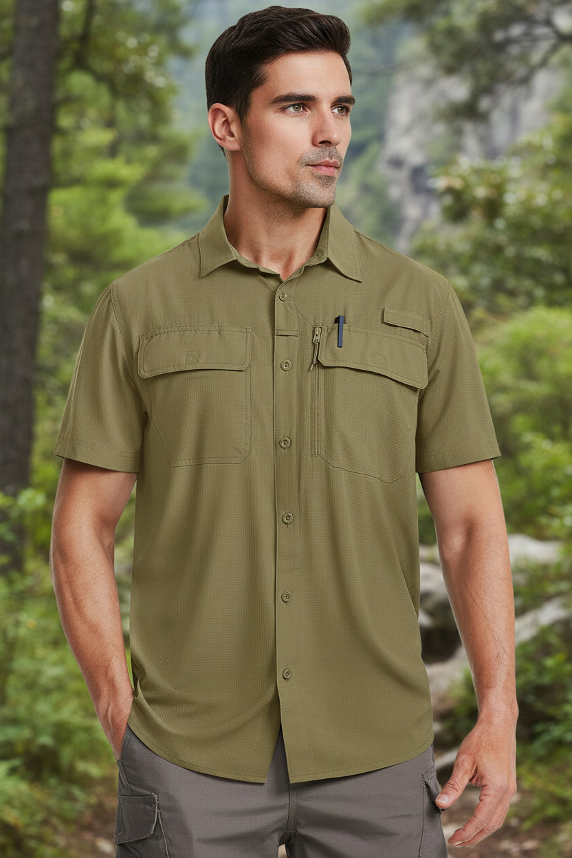 Man wearing a green short-sleeve shirt with pockets on a white background