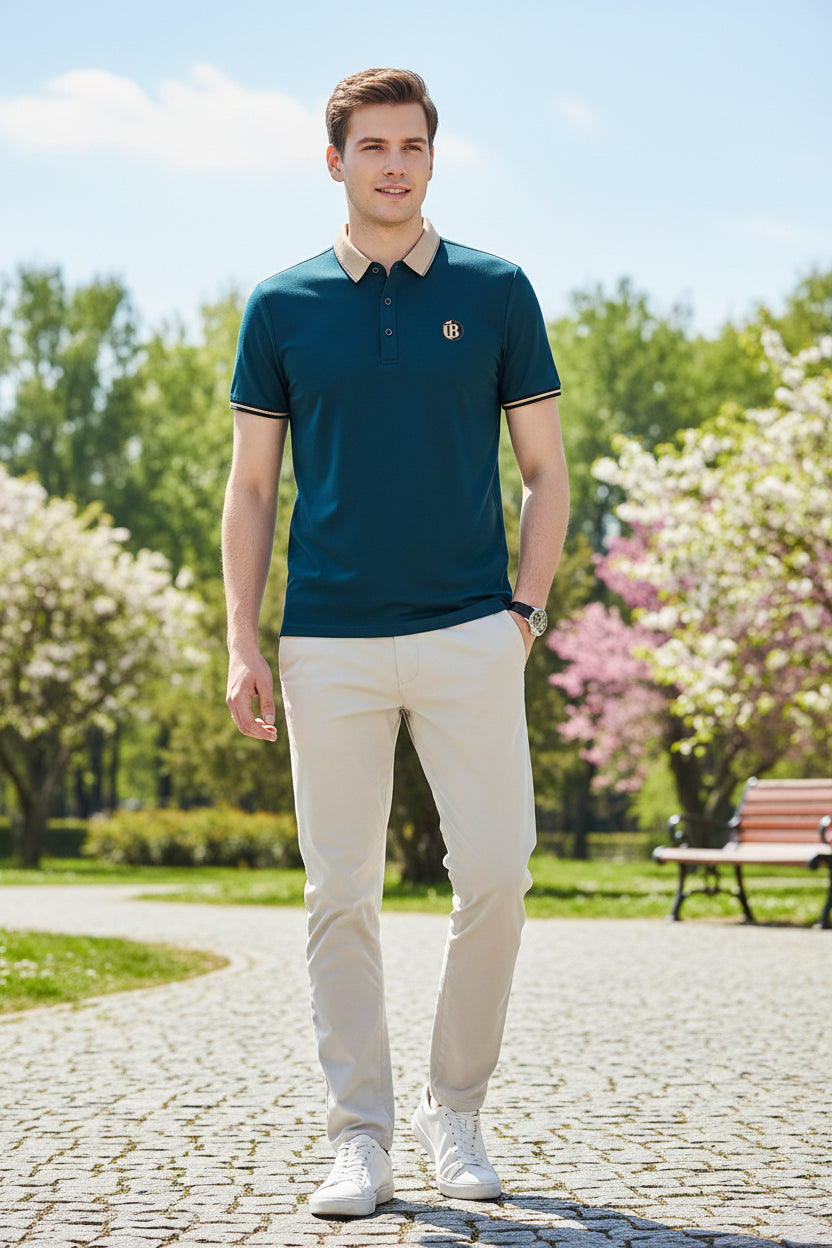 Teal polo shirt with a logo on a gray background