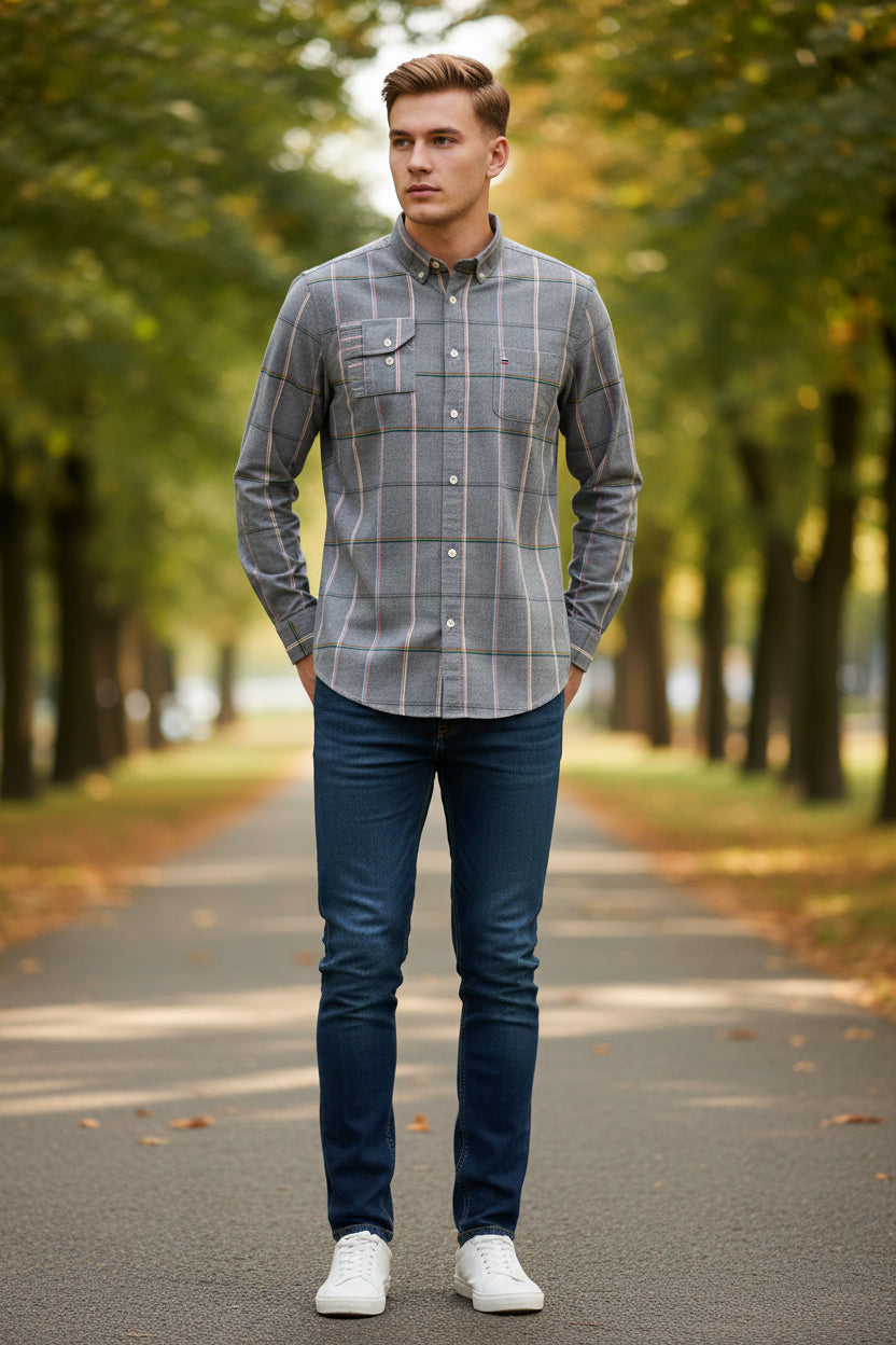 Folded gray plaid shirt with brand logo and text on a white background