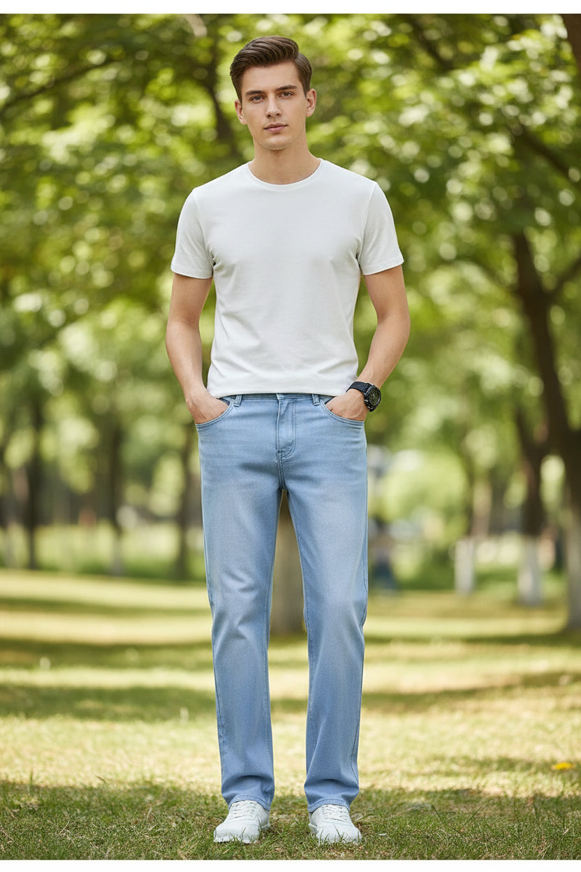 Light blue jeans being worn on a gray background with text about comfort and elasticity.