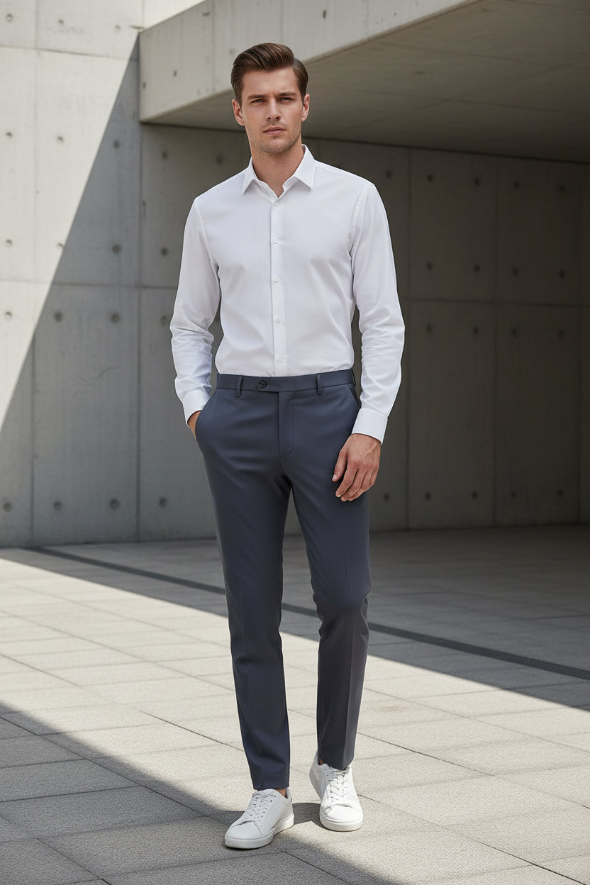 Folded gray pants on a light gray surface
