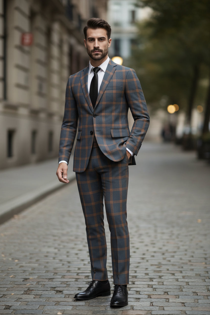Man wearing a plaid suit with a blurred background