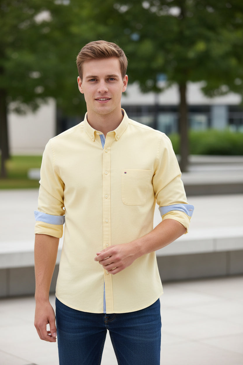Beige shirt with a blue collar on a white background