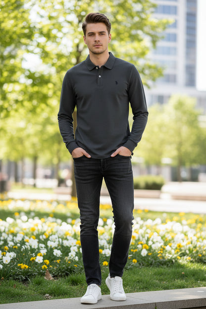 Gray long-sleeve polo shirt on a rack with other colored shirts in the background