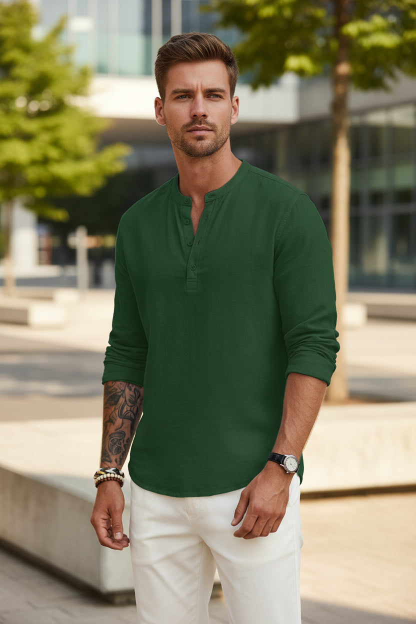 Man wearing a green long-sleeve shirt with a brand logo on a white background