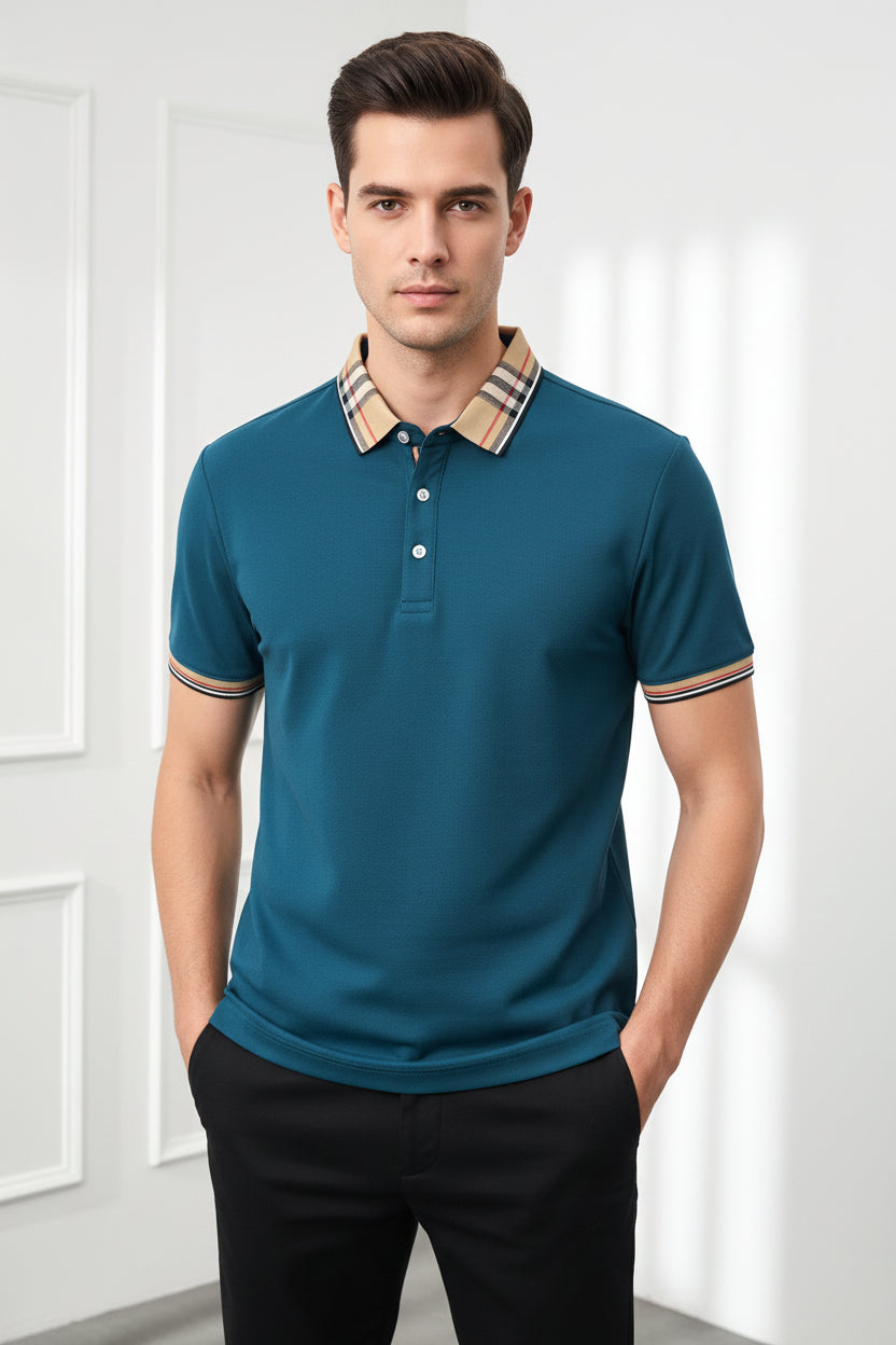 Teal polo shirt with plaid collar held by a hand, brand label visible