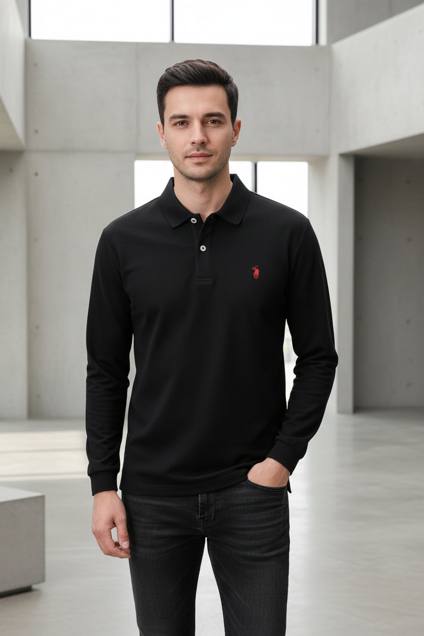 Black polo shirt with a red logo on a hanger, held by a hand.