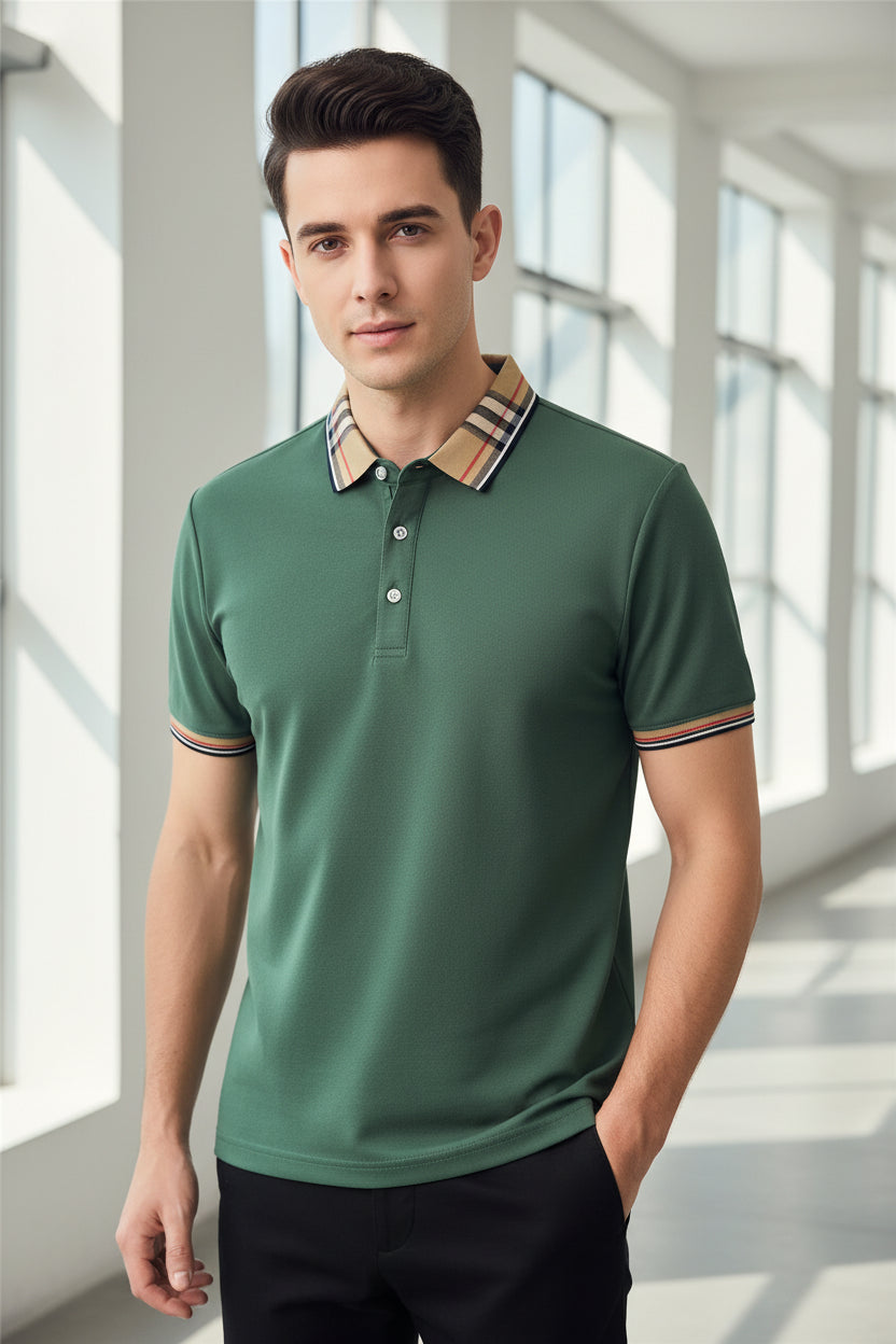 Green polo shirt with plaid collar on a hanger