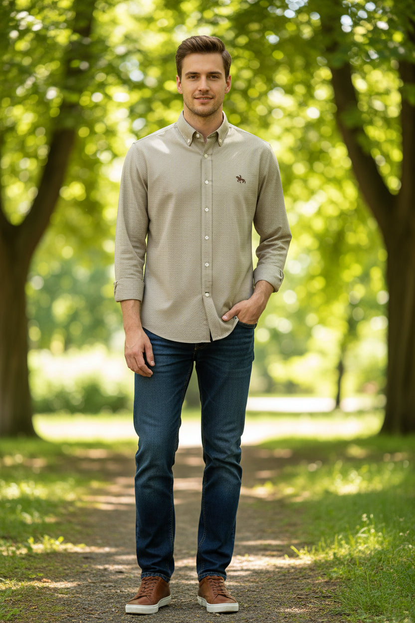 Folded brown checkered shirt with a logo on a white background, labeled 'Oxford Shirts'.