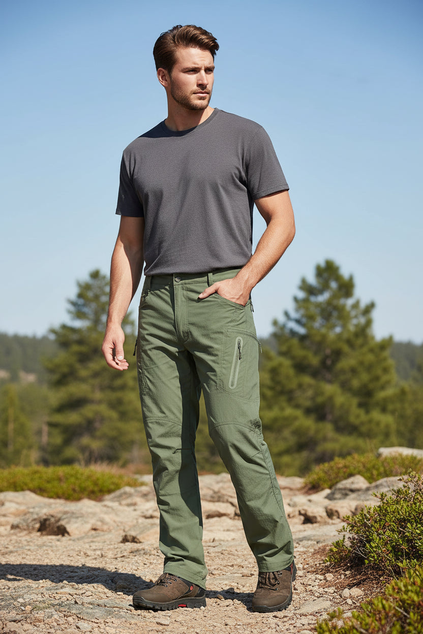 Green pants worn by a person on a white background