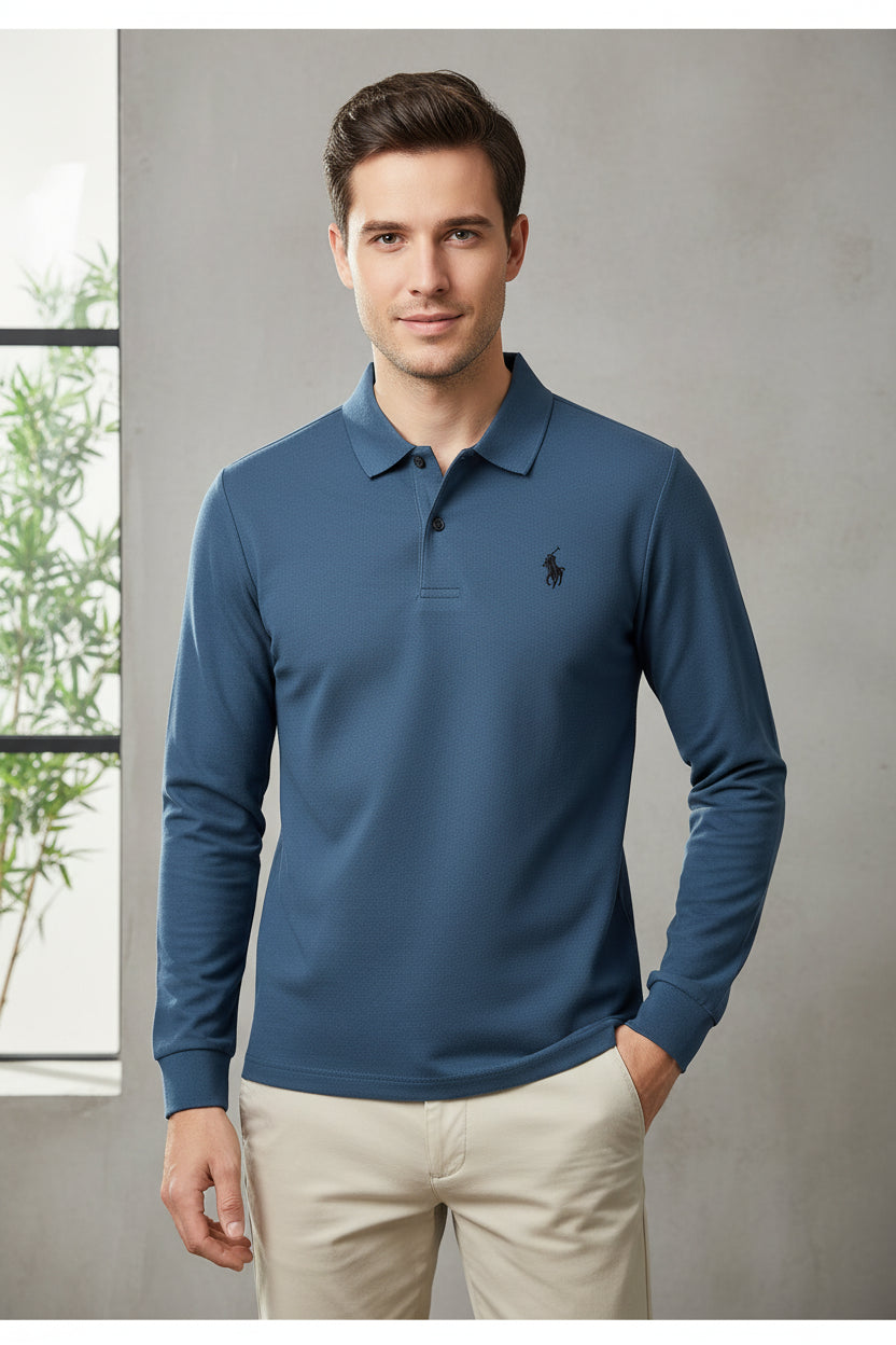Blue long-sleeve polo shirt with a brand logo on a hanger against a background of other colored shirts.