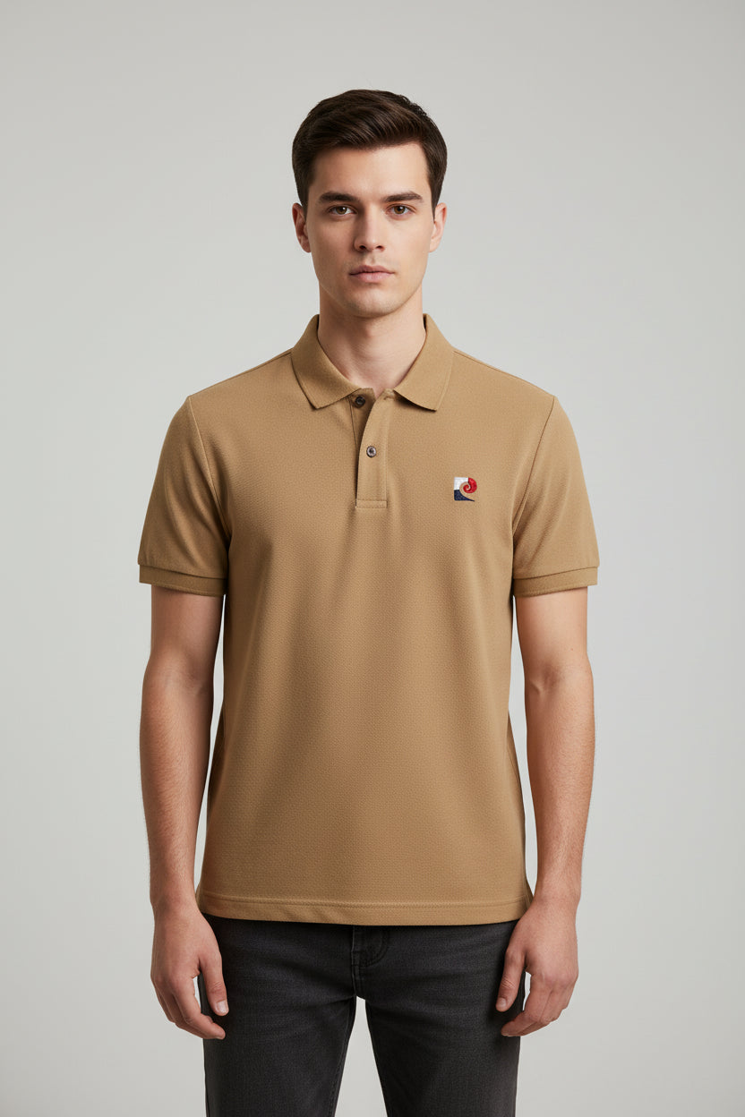 Beige polo shirt with brand logo on a hanger against a clothing store background
