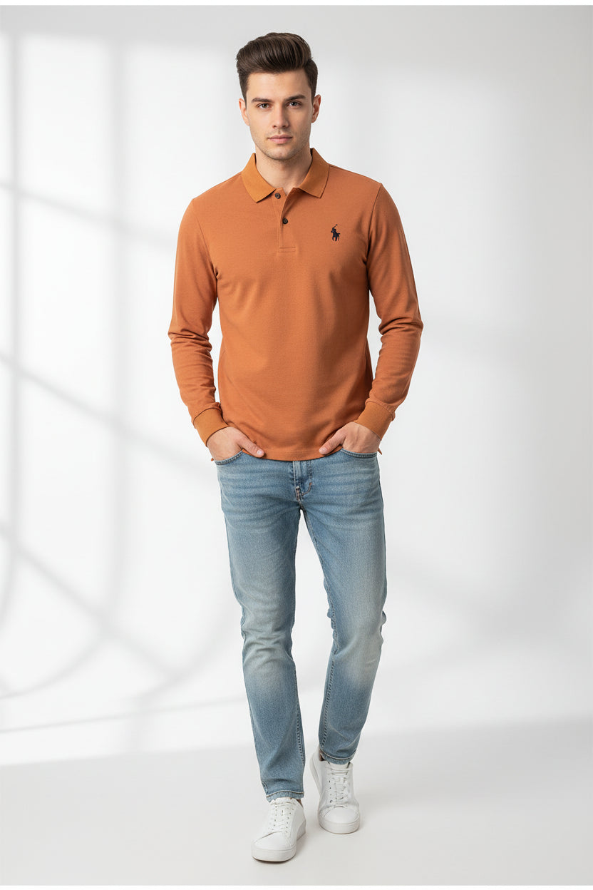 Orange long-sleeve polo shirt with a brand logo on a hanger among other shirts.