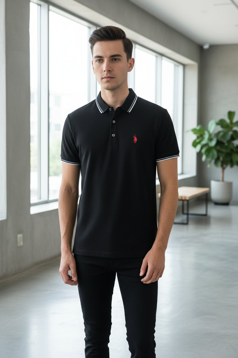 Black polo shirt with a red logo on a rack of clothes