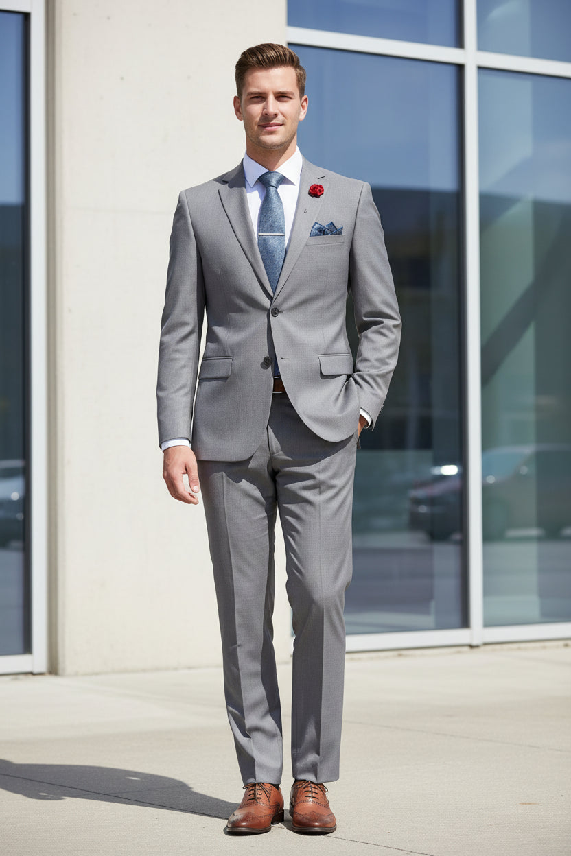 Gray suit with brown shoes on a mannequin against a light blue background
