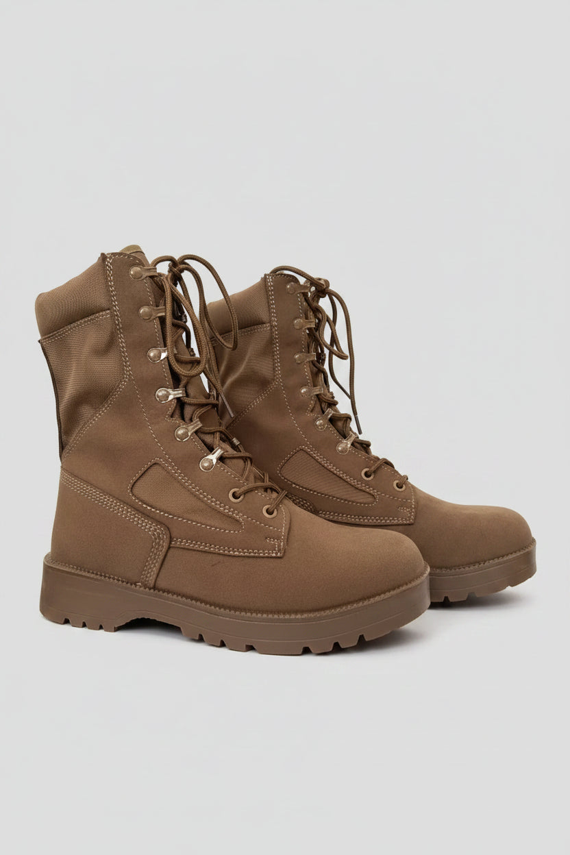 Brown tactical boots with features highlighted against a mountainous background