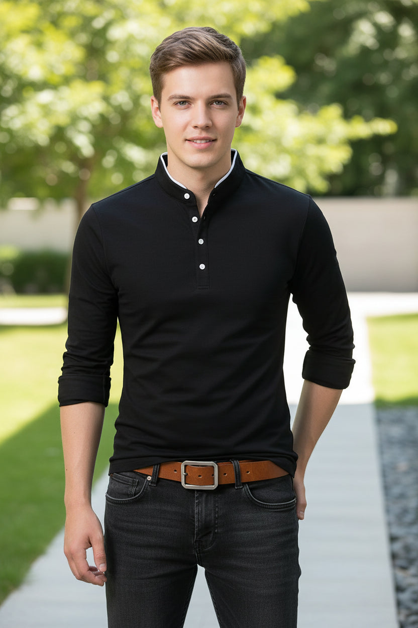 Black long-sleeve shirt worn by a person on a gray background