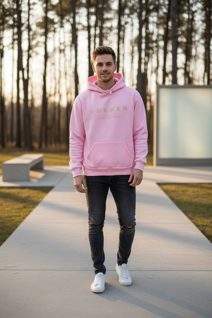 Pink hoodie with 'GOLDEN' text on a casual background