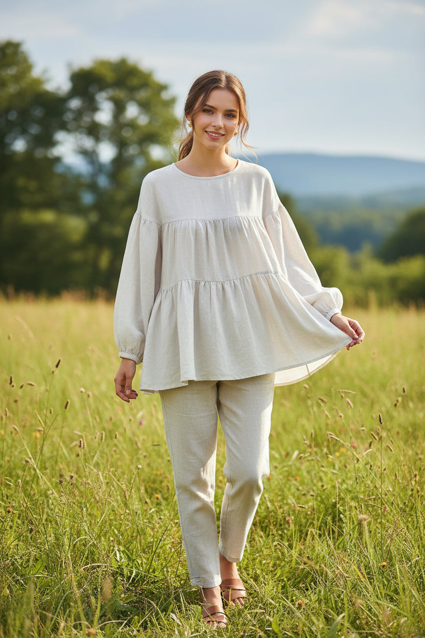White blouse with long sleeves on a wooden hanger against a beige background, ZANZEA brand visible.