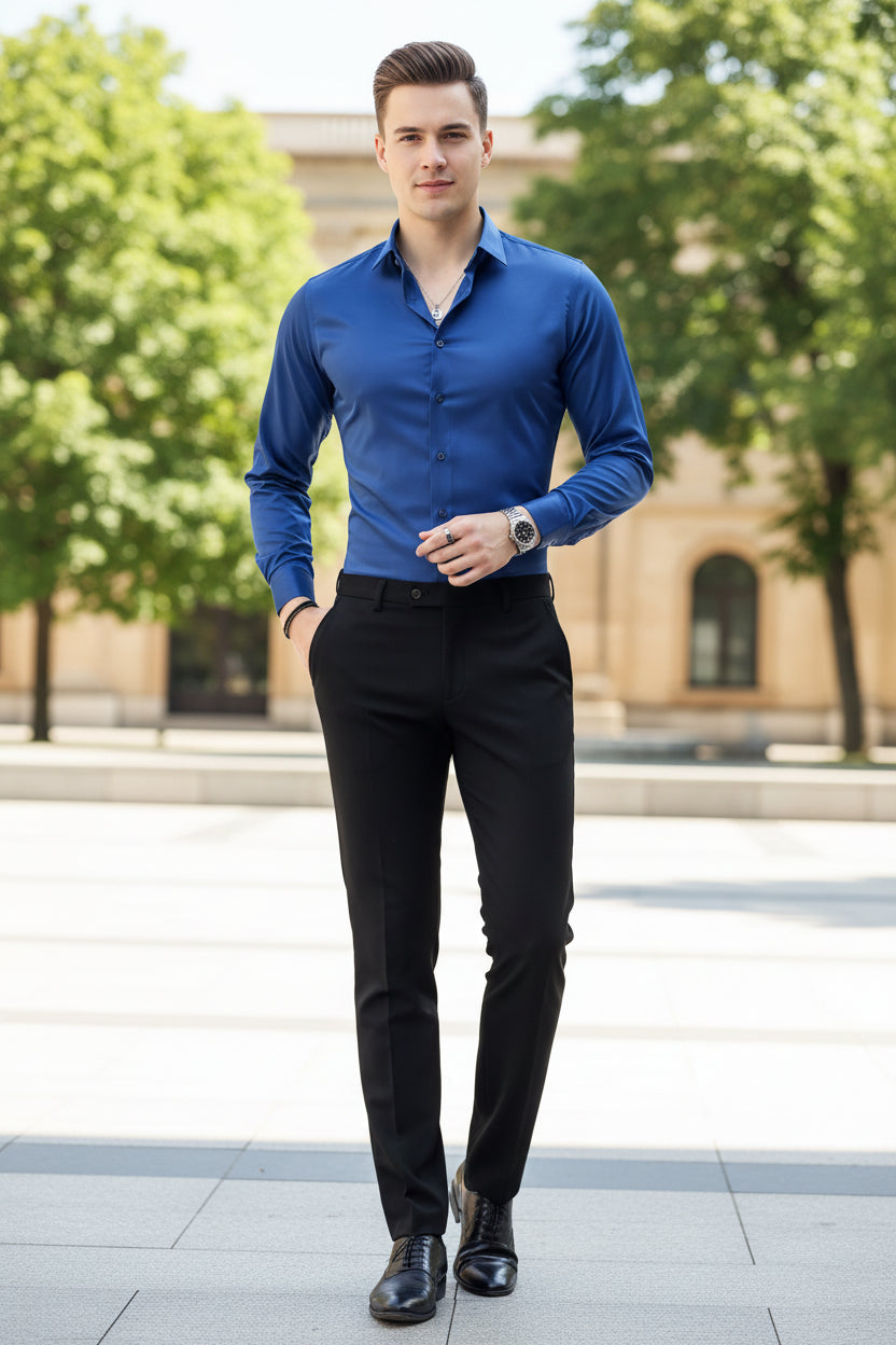 Person wearing a blue dress shirt with a neutral background