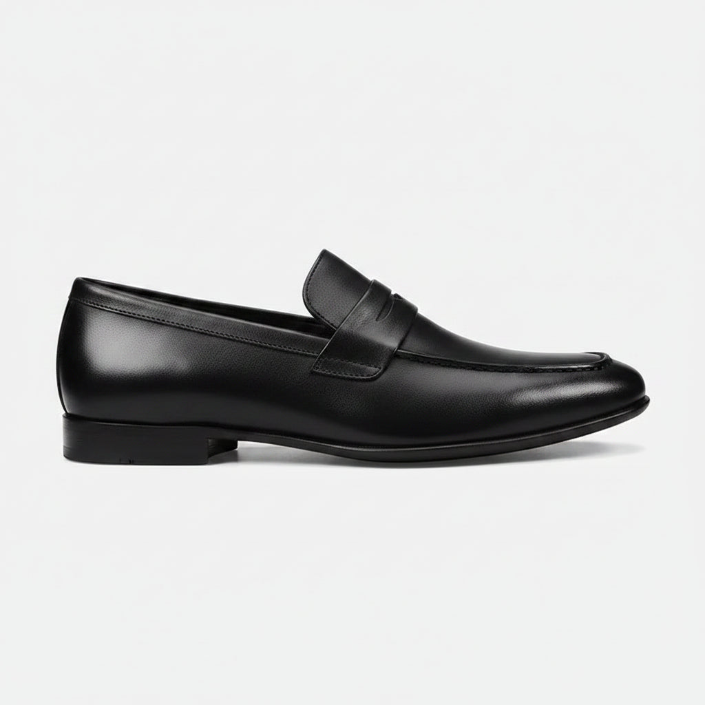Black leather loafer shoe on a white background