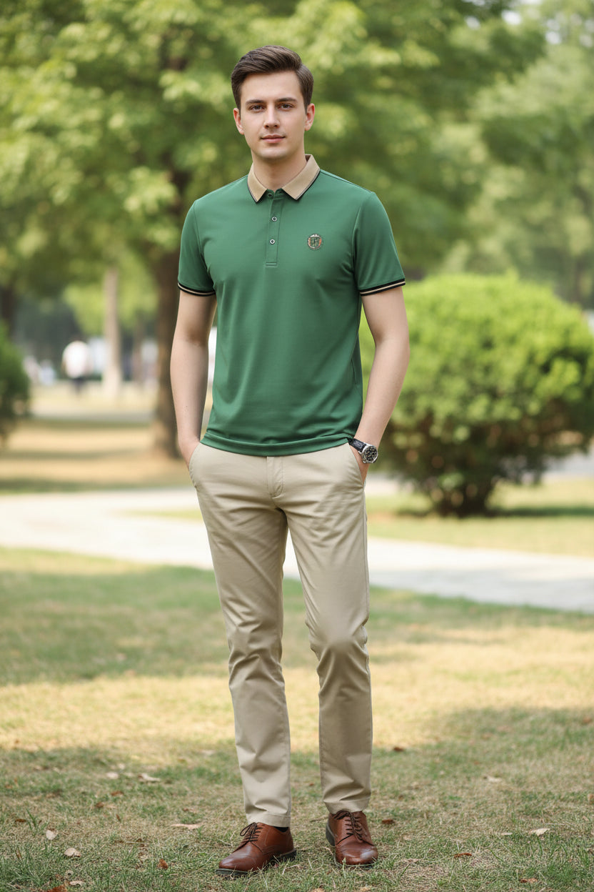 Green polo shirt with a small logo on a gray background