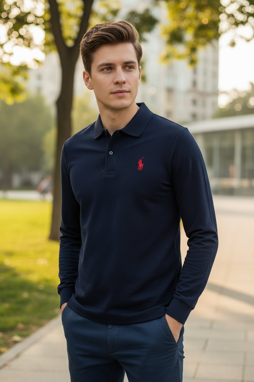 Navy blue polo shirt with a red logo on a hanger in a clothing store.